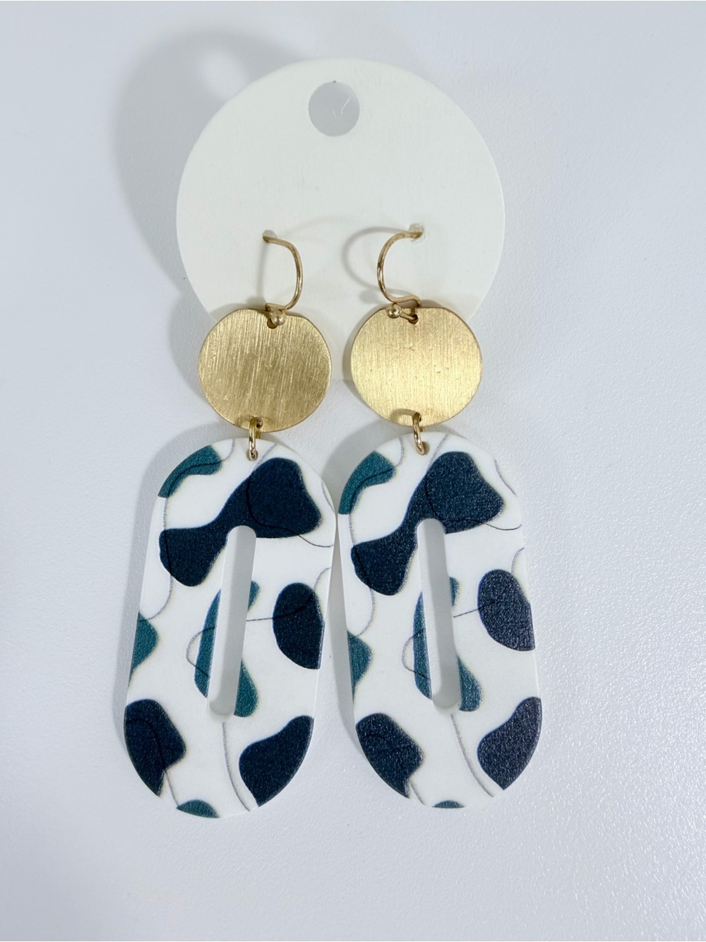 White Resin Drop Earrings with Gold Discs and Dark Teal & Navy Pattern